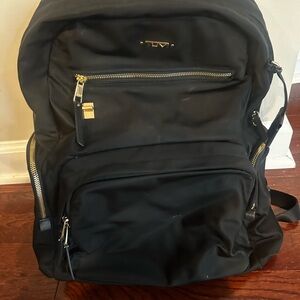 Tumi Black Backpack with Structured Design and Durable Fabric